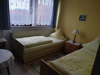 Ein Bett oder Betten in einem Zimmer der Unterkunft Gästehaus zum Georgenberg