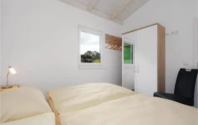 Ein Bett oder Betten in einem Zimmer der Unterkunft Ferienhausdorf Thale