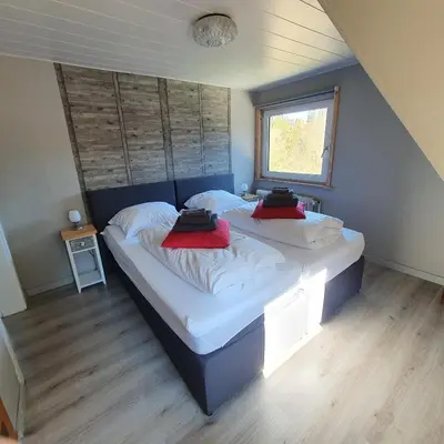 Ein Bett oder Betten in einem Zimmer der Unterkunft B&B Waldcafe