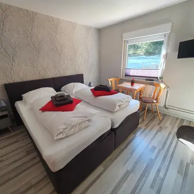 Ein Bett oder Betten in einem Zimmer der Unterkunft B&B Waldcafe