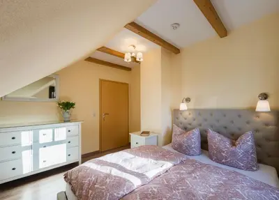 Ein Bett oder Betten in einem Zimmer der Unterkunft Bellevue Ferienwohnungen