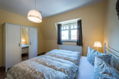 Ein Bett oder Betten in einem Zimmer der Unterkunft Bellevue Ferienwohnungen