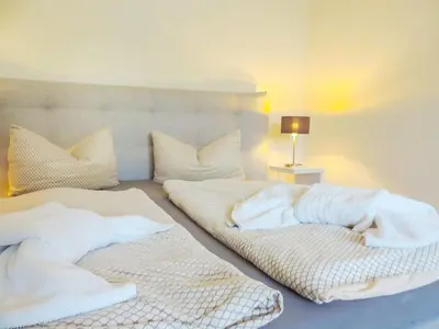 Ein Bett oder Betten in einem Zimmer der Unterkunft Harzer Grabenhaus