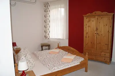 Ein Bett oder Betten in einem Zimmer der Unterkunft Hotel Am Kurpark