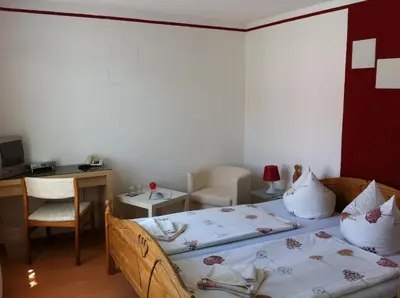 Ein Bett oder Betten in einem Zimmer der Unterkunft Hotel Am Kurpark
