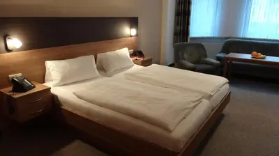 Ein Bett oder Betten in einem Zimmer der Unterkunft Pension Villa Irene