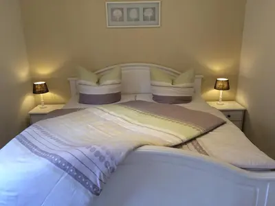 Ein Bett oder Betten in einem Zimmer der Unterkunft Ferienwohnung unterm Schreckensturm