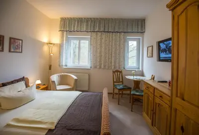 Ein Bett oder Betten in einem Zimmer der Unterkunft Kurhotel Bad Suderode