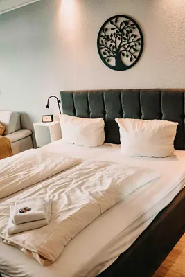 Ein Bett oder Betten in einem Zimmer der Unterkunft Haus Vier Jahreszeiten am See HS 463