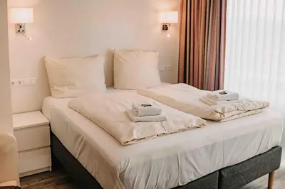 Ein Bett oder Betten in einem Zimmer der Unterkunft Haus Vier Jahreszeiten am See HS 939