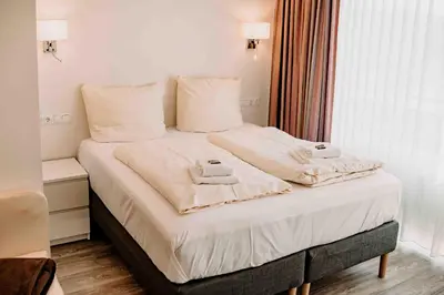 Ein Bett oder Betten in einem Zimmer der Unterkunft Haus Vier Jahreszeiten am See HS 939