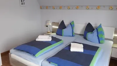 Ein Bett oder Betten in einem Zimmer der Unterkunft Ferienwohnungen Steeg