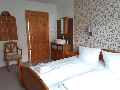 Ein Bett oder Betten in einem Zimmer der Unterkunft Ferienwohnung Rieger 1