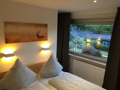 Ein Bett oder Betten in einem Zimmer der Unterkunft Ferienhaus Goethestrasse