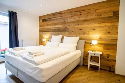 Ein Bett oder Betten in einem Zimmer der Unterkunft Schiefer Suite Hotel & Apartments