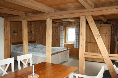 Ein Bett oder Betten in einem Zimmer der Unterkunft Apartments Café Brennnessel