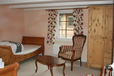 Ein Bett oder Betten in einem Zimmer der Unterkunft Apartments Café Brennnessel