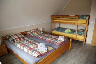 Ein Bett oder Betten in einem Zimmer der Unterkunft Gästehaus am Kirschberg
