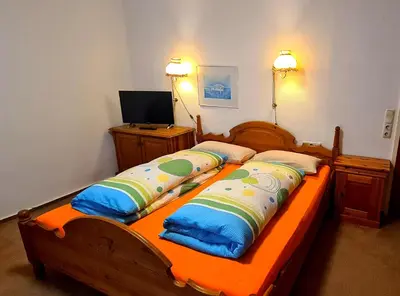 Ein Bett oder Betten in einem Zimmer der Unterkunft Hotel garni Am Hochwald