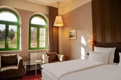 Ein Bett oder Betten in einem Zimmer der Unterkunft Schlosshotel Blankenburg