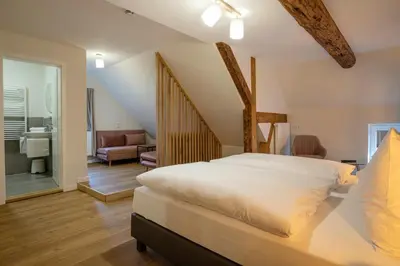Ein Bett oder Betten in einem Zimmer der Unterkunft Altstadthotel Zur Börse