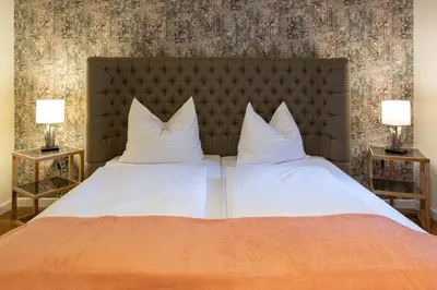 Ein Bett oder Betten in einem Zimmer der Unterkunft Altstadthotel Zur Börse