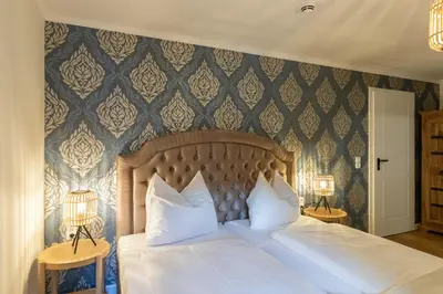 Ein Bett oder Betten in einem Zimmer der Unterkunft Altstadthotel Zur Börse