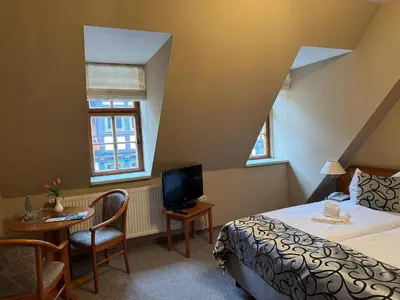 Ein Bett oder Betten in einem Zimmer der Unterkunft Hotel Zum Kanzler