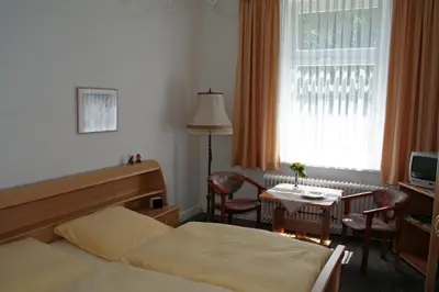 Ein Bett oder Betten in einem Zimmer der Unterkunft Hotel Fernblick