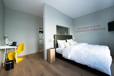 Ein Bett oder Betten in einem Zimmer der Unterkunft LIONO BoutiqueHotel