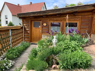 Ein Garten an der Unterkunft Blockhausvermietung 