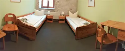 Ein Bett oder Betten in einem Zimmer der Unterkunft Hotel Gasthaus Weisser Mönch