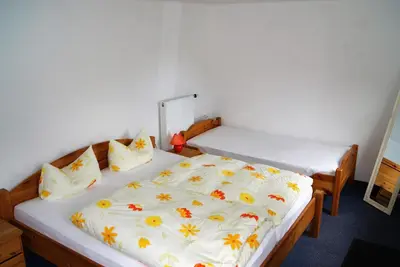 Ein Bett oder Betten in einem Zimmer der Unterkunft Ferienwohnung Nitzschke