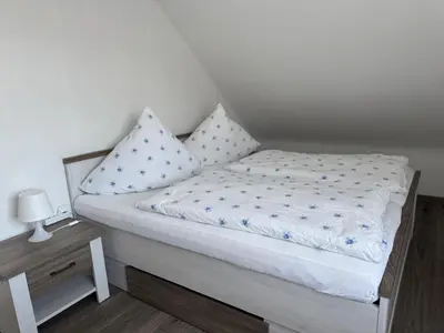 Ein Bett oder Betten in einem Zimmer der Unterkunft Ferienwohnung Manja
