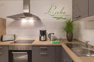 Küche/Küchenzeile in der Unterkunft Ferienwohnung am Schlosspark