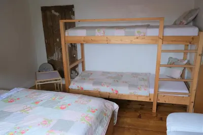 Ein Bett oder Betten in einem Zimmer der Unterkunft Ursprüngliches Harzhaus für Aktive in Clausthal