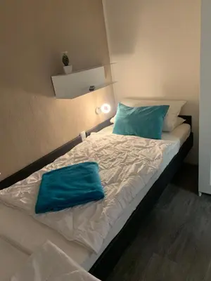 Ein Bett oder Betten in einem Zimmer der Unterkunft Hahnenklee Ferienpark 409 & 211