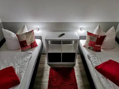Ein Bett oder Betten in einem Zimmer der Unterkunft Hahnenklee Ferienpark 409 & 211