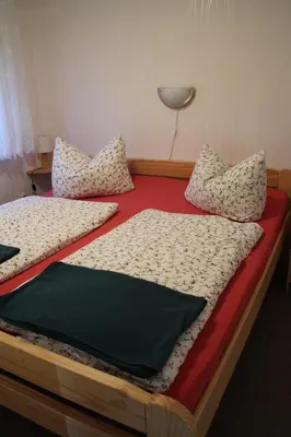 Ein Bett oder Betten in einem Zimmer der Unterkunft Ferienhäuser 