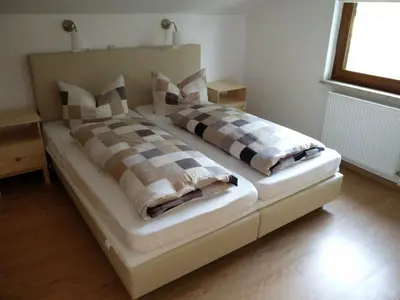 Ein Bett oder Betten in einem Zimmer der Unterkunft Ferienhaus Förster III