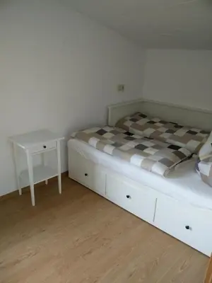 Ein Bett oder Betten in einem Zimmer der Unterkunft Ferienhaus Förster III