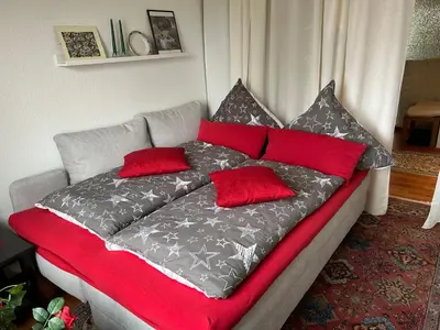 Ein Bett oder Betten in einem Zimmer der Unterkunft FeWo Parkblick mit 2 Bädern