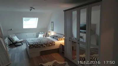 Ein Bett oder Betten in einem Zimmer der Unterkunft Ferienwohnung An der Jordanshöhe