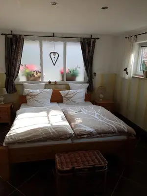 Ein Bett oder Betten in einem Zimmer der Unterkunft Ferienhaus zum Vogelnest