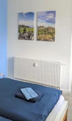 Ein Bett oder Betten in einem Zimmer der Unterkunft Goethes liebste Betten - stilvolle Ferienwohnungen im historischen Fachwerkhaus in Wernigerode - Parkplatz, Smart-TV, W-Lan