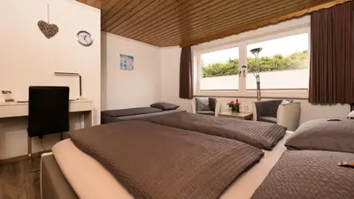 Ein Bett oder Betten in einem Zimmer der Unterkunft Hotel Brunnenbach
