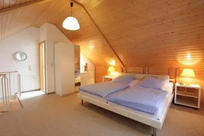 Ein Bett oder Betten in einem Zimmer der Unterkunft Ferienwohnungen Am Elfenstein