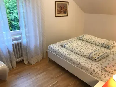 Ein Bett oder Betten in einem Zimmer der Unterkunft Ferienwohnungen Am Elfenstein