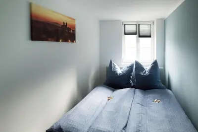 Ein Bett oder Betten in einem Zimmer der Unterkunft FachwerQ'sleep Apartments adults only