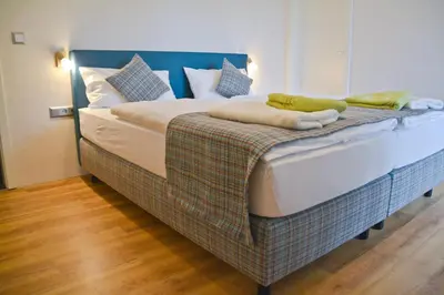 Ein Bett oder Betten in einem Zimmer der Unterkunft Ferienblockhaus Auerhahn & Luchs